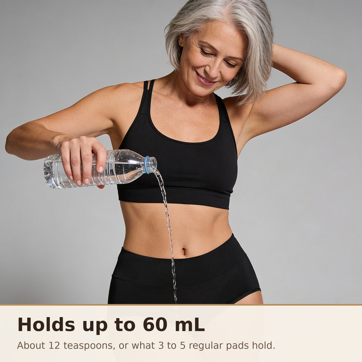 A woman pouring a bottle of water onto Puredries leakproof underwear: holds up to 60 mL, about 12 teaspoons